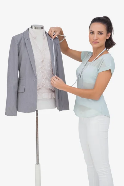 Fashion designer measuring blazer — Stock Photo, Image