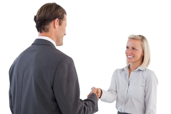 Zakenman die zakelijke vrouw hand — Stockfoto