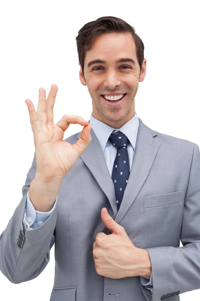 Cheerful businessman showing ok sign — Stock Photo, Image
