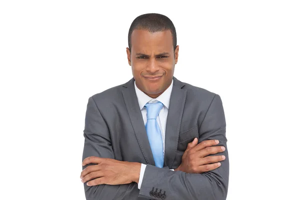 Doubtful businessman with arms crossed — Stock Photo, Image