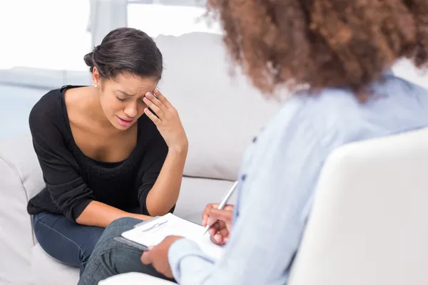 Woman getting depressed in therapy — Stock Photo, Image