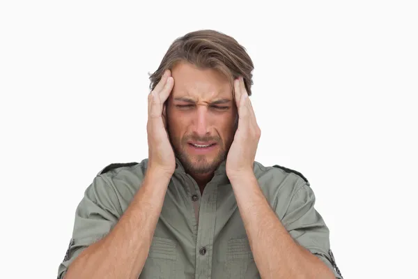 Homem suspirando com dor de cabeça — Fotografia de Stock