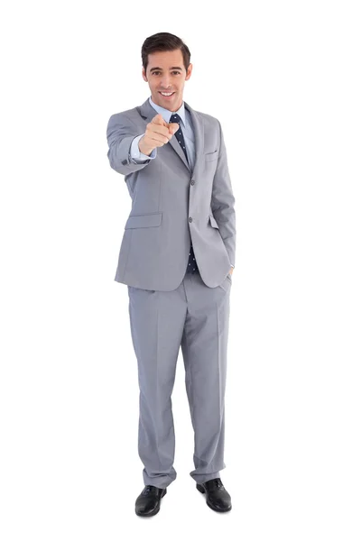 Smiling businessman pointing at the camera — 图库照片