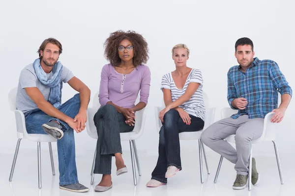 Stylish sitting and looking at camera — Stock Photo, Image