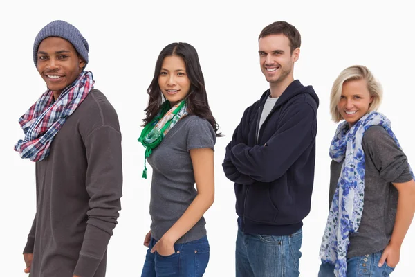 Stylish young in a row smiling — Stock Photo, Image