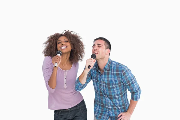 Fun duo singing at karaoke Royalty Free Stock Photos