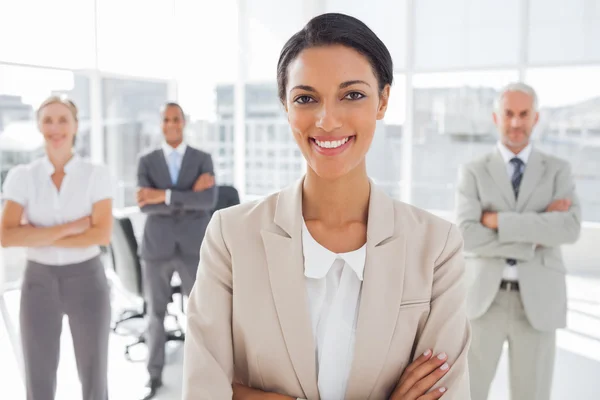 Attractive businesswoman with arms crossed Stock Picture