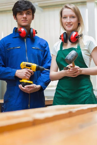 Two woodworking students standing before a workbench — Stock Photo, Image