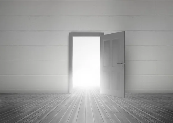 Door opening to reveal bright light — Stock Photo, Image