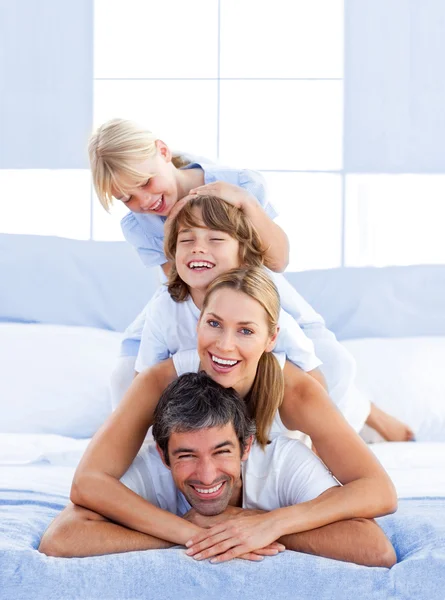 Family piled on top of dad — Stock Photo, Image