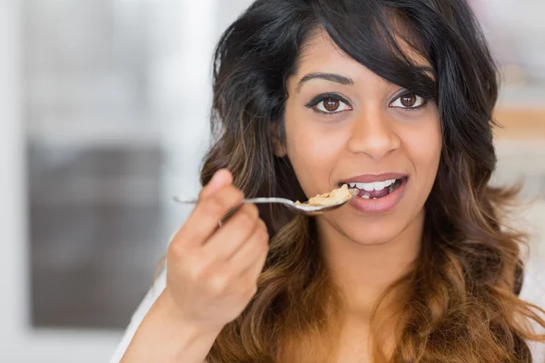 Woman holding a spoon with cereal — Stock Photo, Image