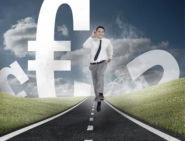 Happy businessman running on a road with euro currency — Stock Photo, Image