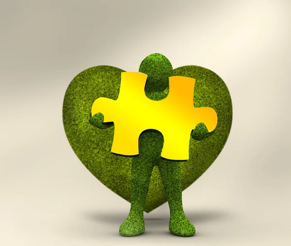 Green character holding a yellow jigsaw — Stock Photo, Image