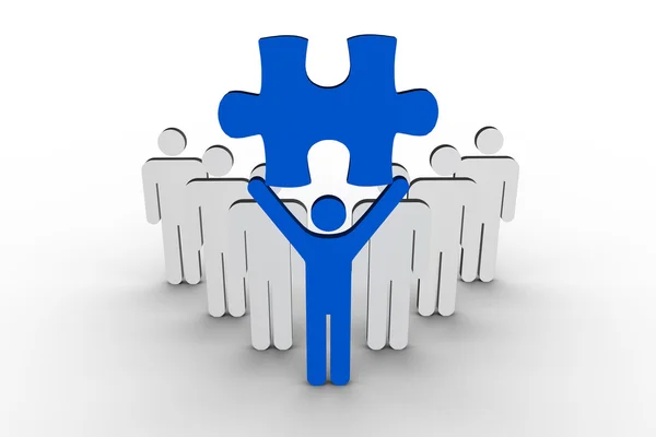 Leader holding blue jigsaw piece next to line of human figures — Stock Photo, Image