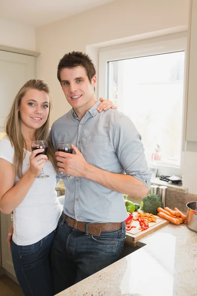 Couple drinking wine in the kitchen — Stock Photo, Image