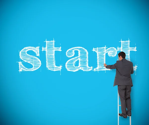 Businessman writing start with chalk — Stock Photo, Image