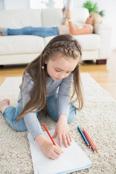 Little girl sitting at the floor — Stock Photo, Image