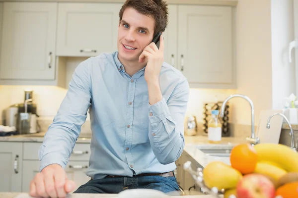 Man calling in the kitchen — Stock Photo, Image