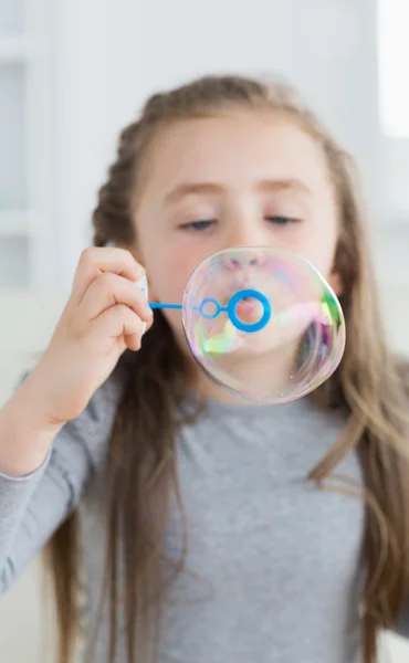 Girl blowing bubbles — Stock Photo, Image