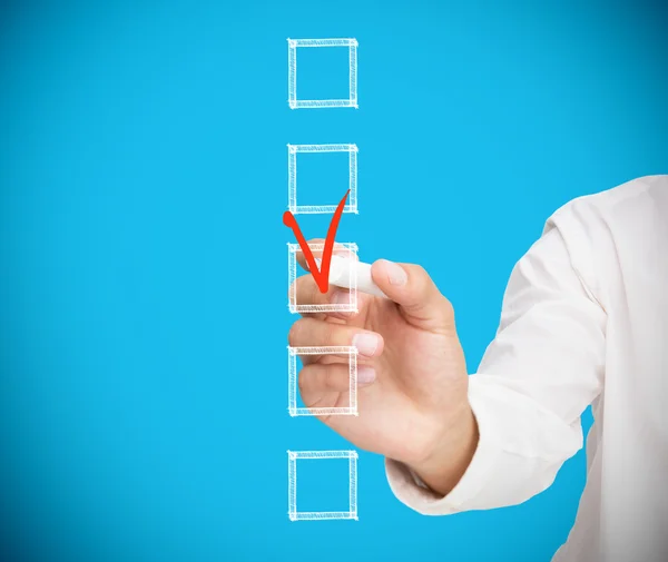 Businesswoman ticking a box in red — Stock Photo, Image