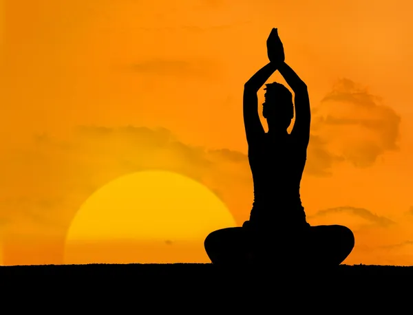 Calm silhouette of woman doing yoga — Stock Photo, Image