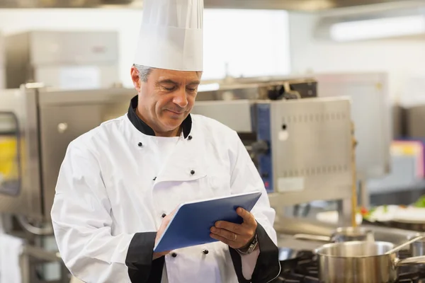 Chef using his digital tablet — Stock Photo, Image