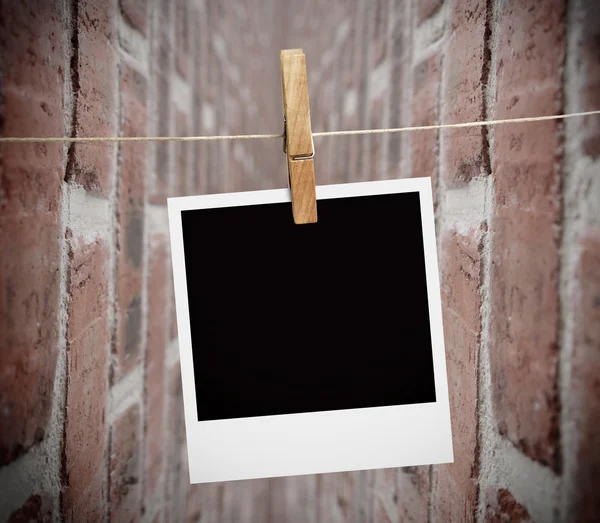 Instant print transfer hung with peg — Stock Photo, Image