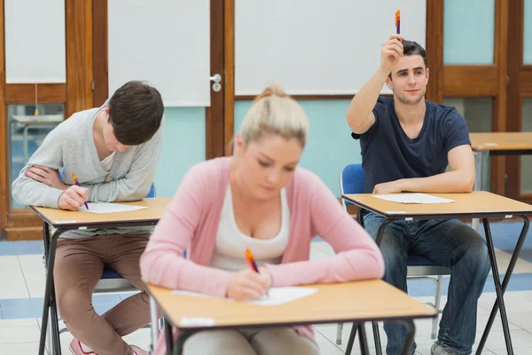 Student wanting to ask question in class — Stock Photo, Image