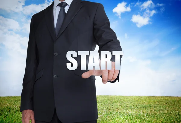 Businessman selecting start word — Stock Photo, Image