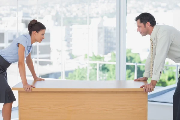 Business facing off at desk — Stock Photo, Image