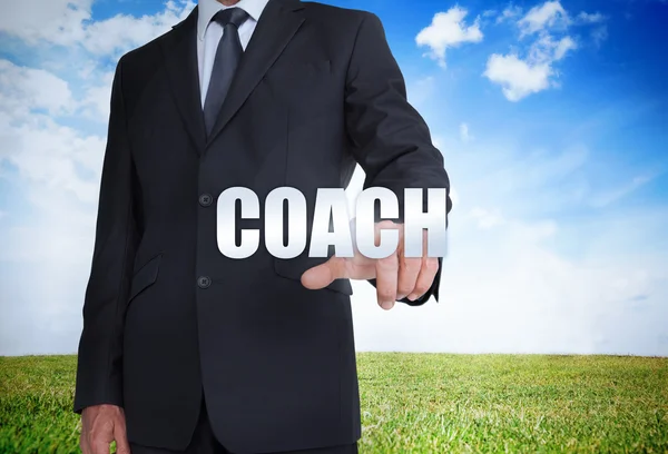 Businessman selecting coach word — Stock Photo, Image