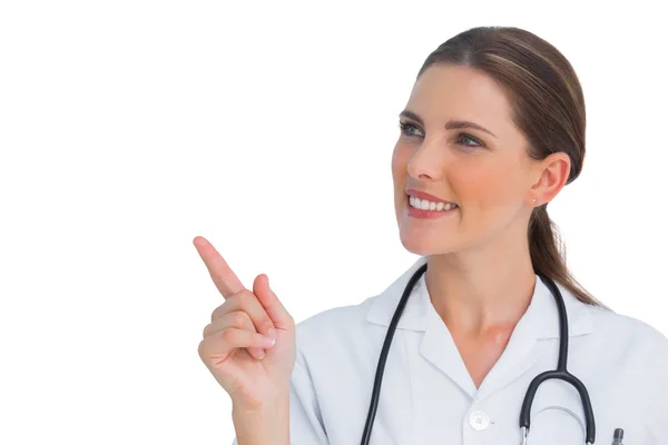 Happy nurse pointing up — Stock Photo, Image