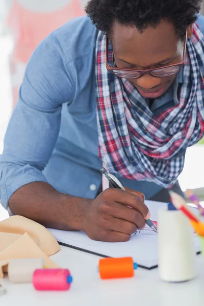 Fashion designer colouring a draw — Stock Photo, Image