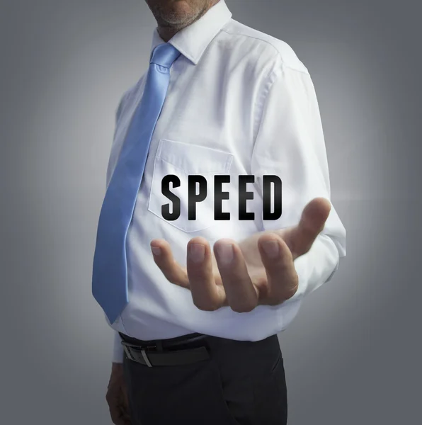 Affärsman håller word hastigheten — Stockfoto