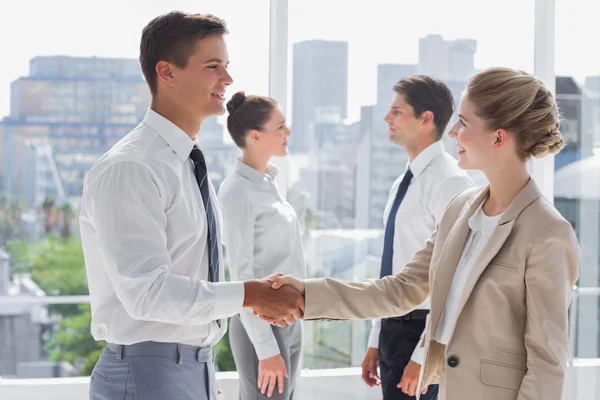 Partners giving a handshake — Stock Photo, Image