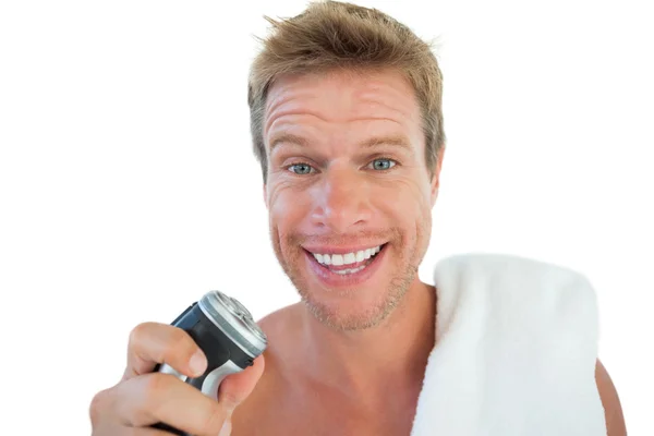 Przystojny mężczyzna trzyma elektryczne maszynki do golenia — Zdjęcie stockowe
