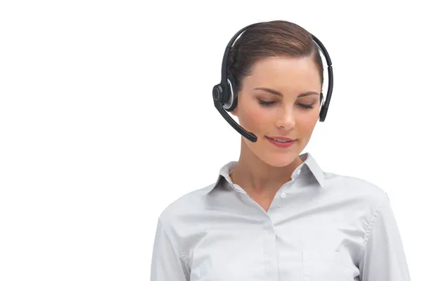 Smiling call centre agent wearing headset — Stock Photo, Image