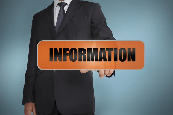 Бизнесмен трогает слово "информация" — стоковое фото