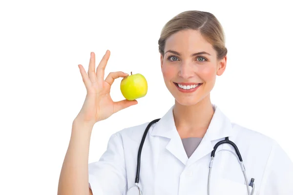 Nurse showing apple — Stock Photo, Image