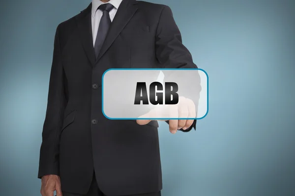 Businessman touching tag with agb written on it — Stock Photo, Image