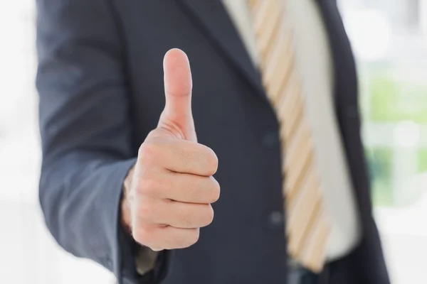 Businessman giving thumbs up — Stock Photo, Image