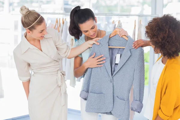 Attractive women looking at blazer — Stock Photo, Image