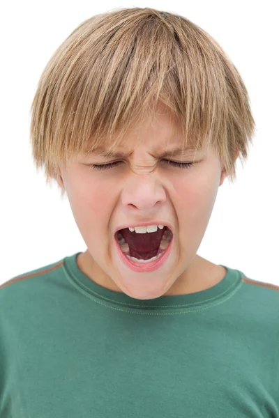 Furious little boy shouting with eyes closed — Stock Photo, Image