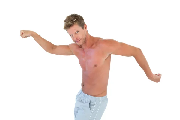 Shirtless man gesturing and showing his muscles — Stock Photo, Image