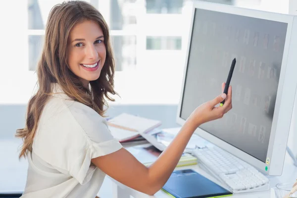 Attractive photo editor pointing at the screen — Stock Photo, Image