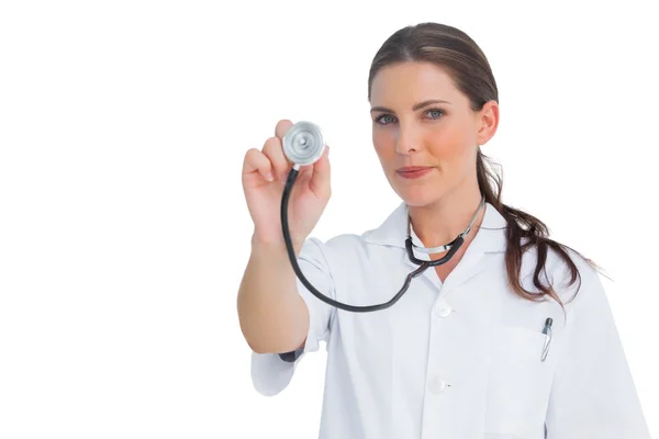 Nurse holding up her stethoscope — Stock Photo, Image