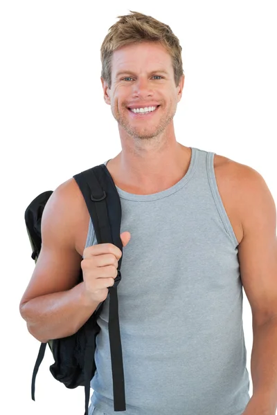 Sonriente hombre en ropa deportiva celebración mochila — Foto de Stock