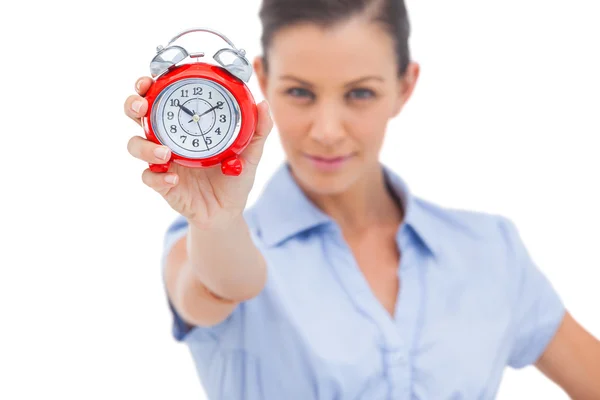 Businesswoman holding alarm clock — Stock Photo, Image