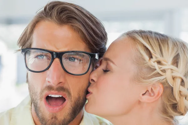 Attractive designer kissing her colleague — Stock Photo, Image
