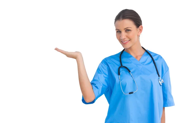 Surgeon holding up hand in presentation — Stock Photo, Image